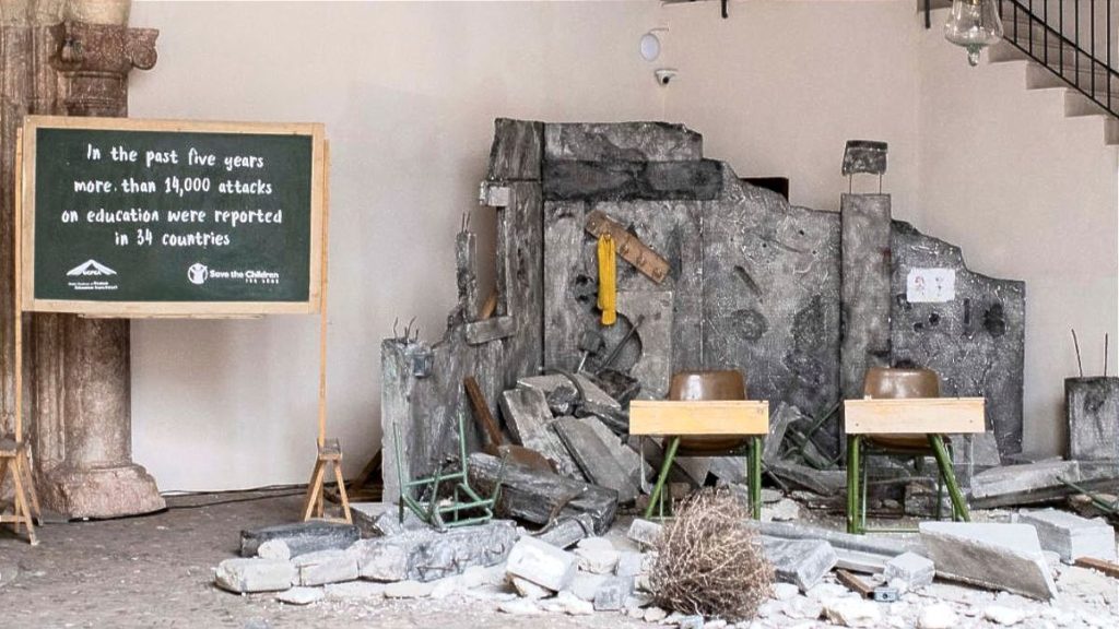 An installation of a bombed-out classroom was placed in Can Balaguer Cultural Centre for the Third International Conference on Safe Schools' welcome reception. Copyright Ministry of Foreign Affairs, European Union and Cooperation of Spain.
